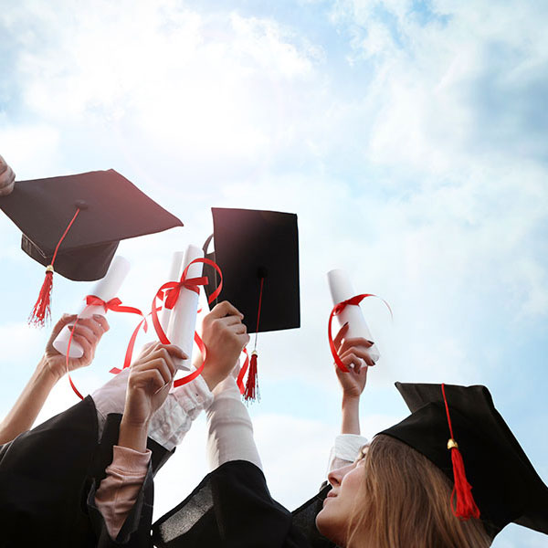 GettyImages-Graduates-Caps-Diplomas-Celebration-Sky