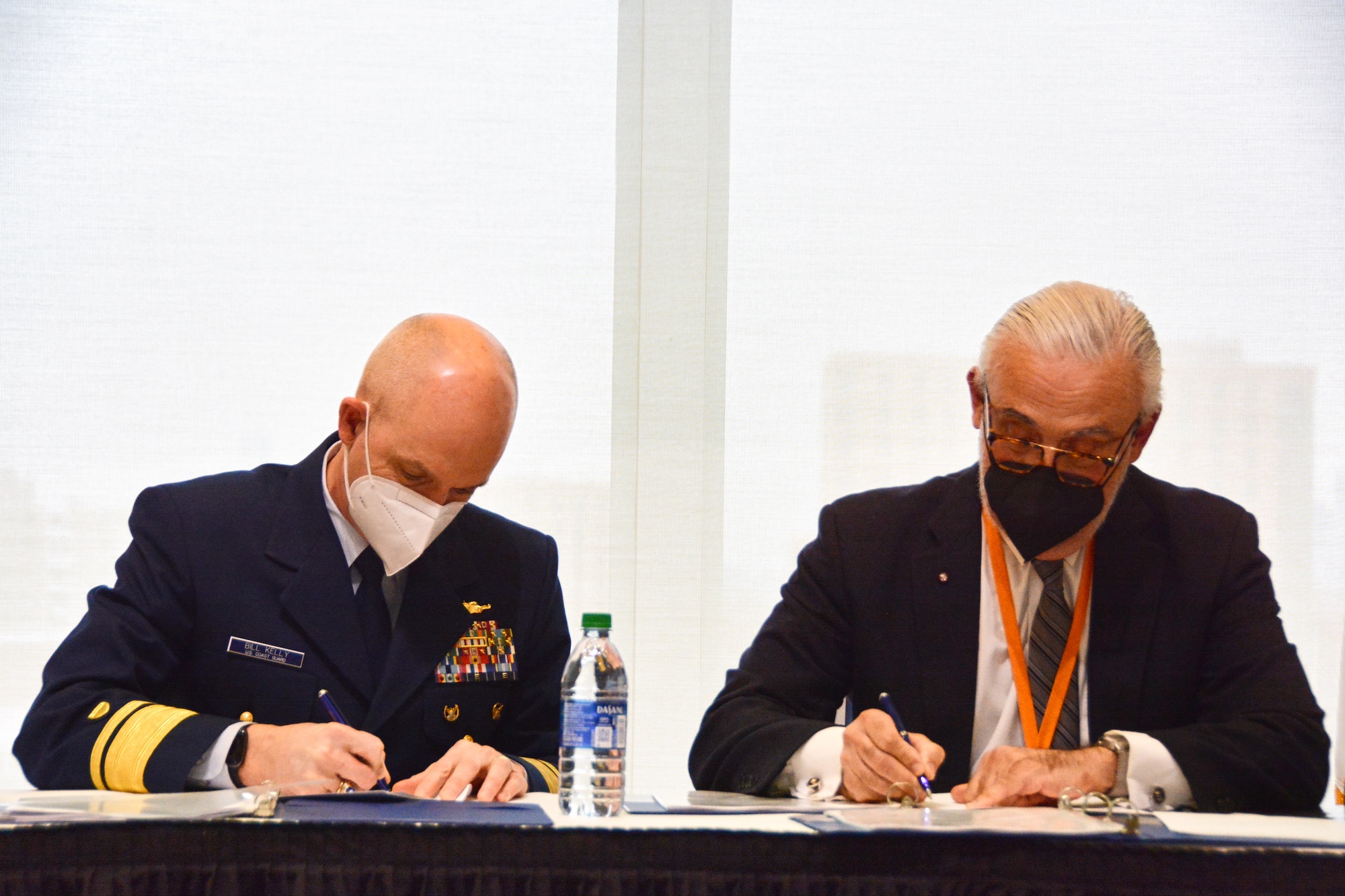 William Kelly and Marcelo Suarez-orozgo sign the agreement