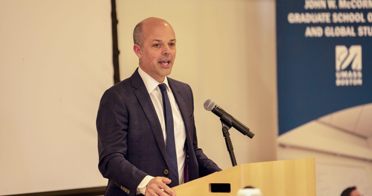 Adam Hinds, the CEO of the Edward M. Kennedy Institute of the United States Senate, addressing MGS graduates.