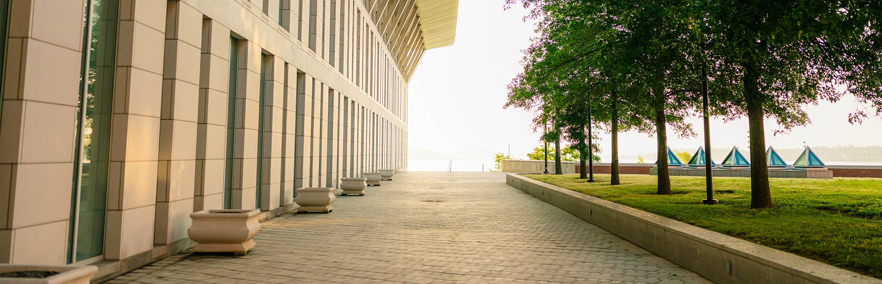 View of side of Campus Center Plaza in bright sun.