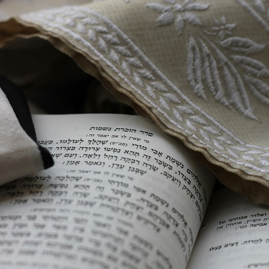 Hebrew text and cloth. Credit Menachem Weinreb unsplash