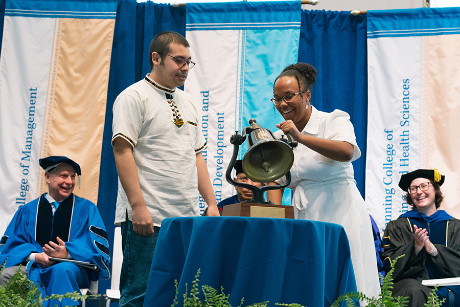 Students ring the Beacon Bell at convocation